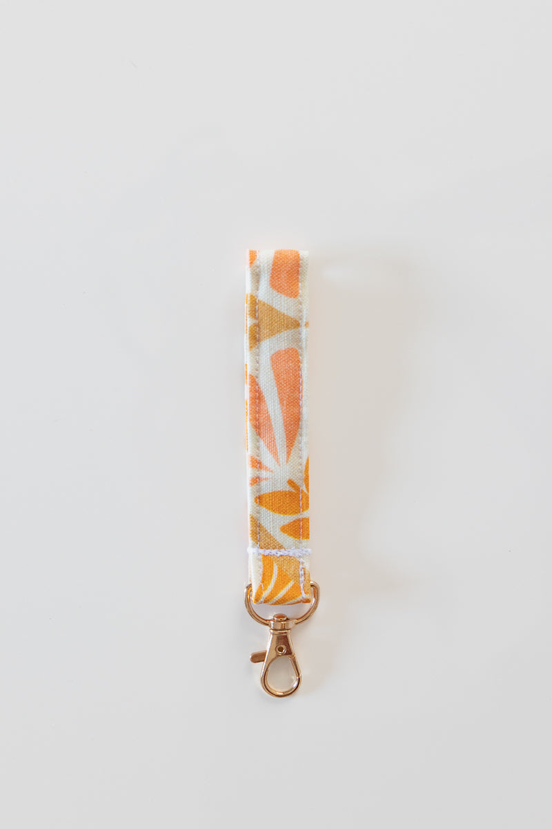 Portachiavi bianco con fiori rosa e arancioni