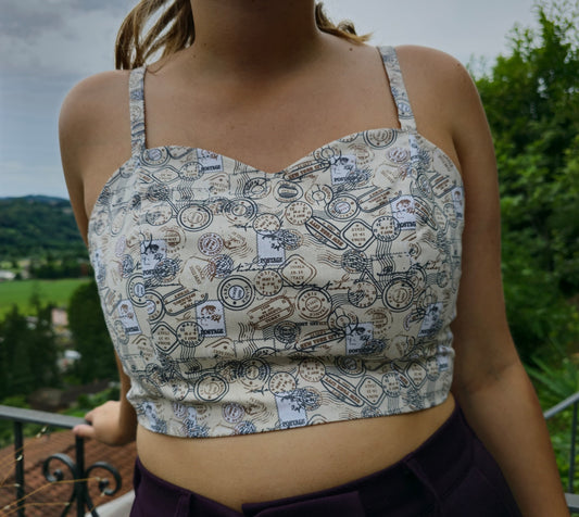 Top regolabile con timbri del mondo