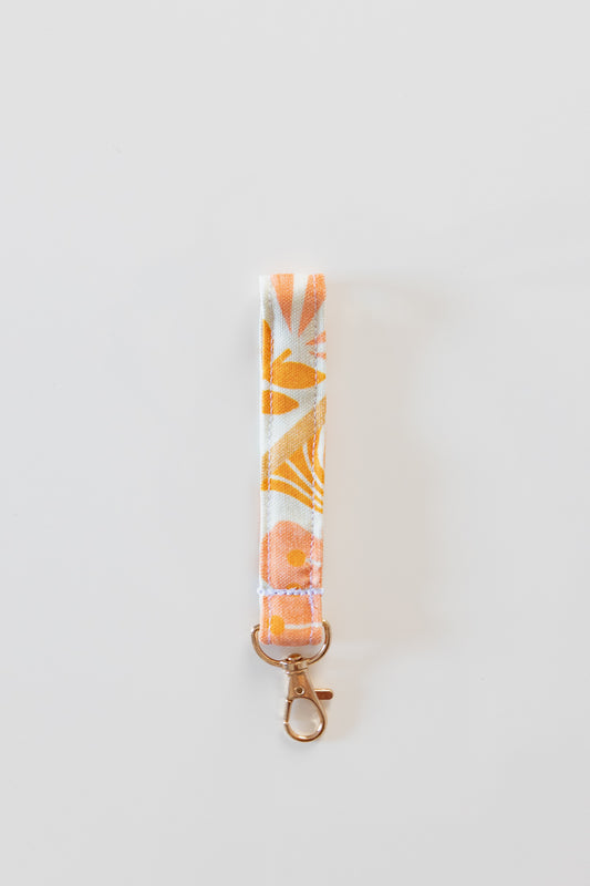 Portachiavi bianco con fiori rosa e arancioni