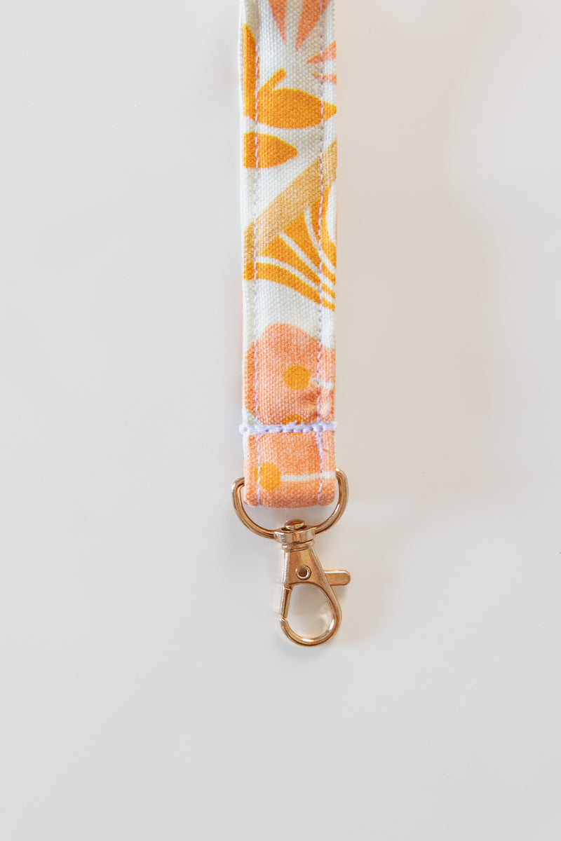 Portachiavi bianco con fiori rosa e arancioni