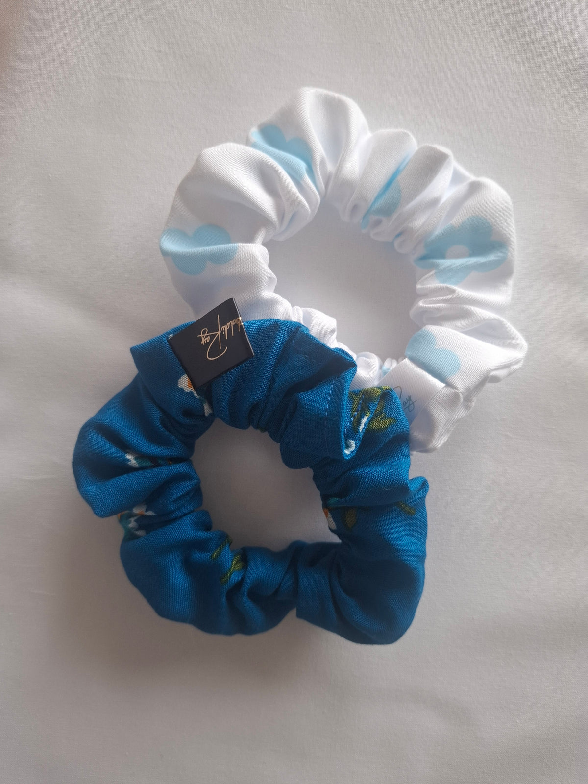 Coleteros de poliéster blancos florales