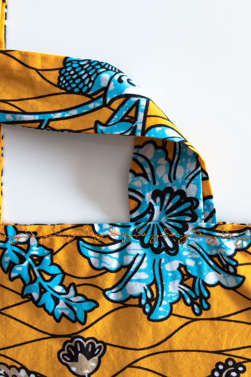 Borsa con tessuto wax giallo, arancione e azzurro